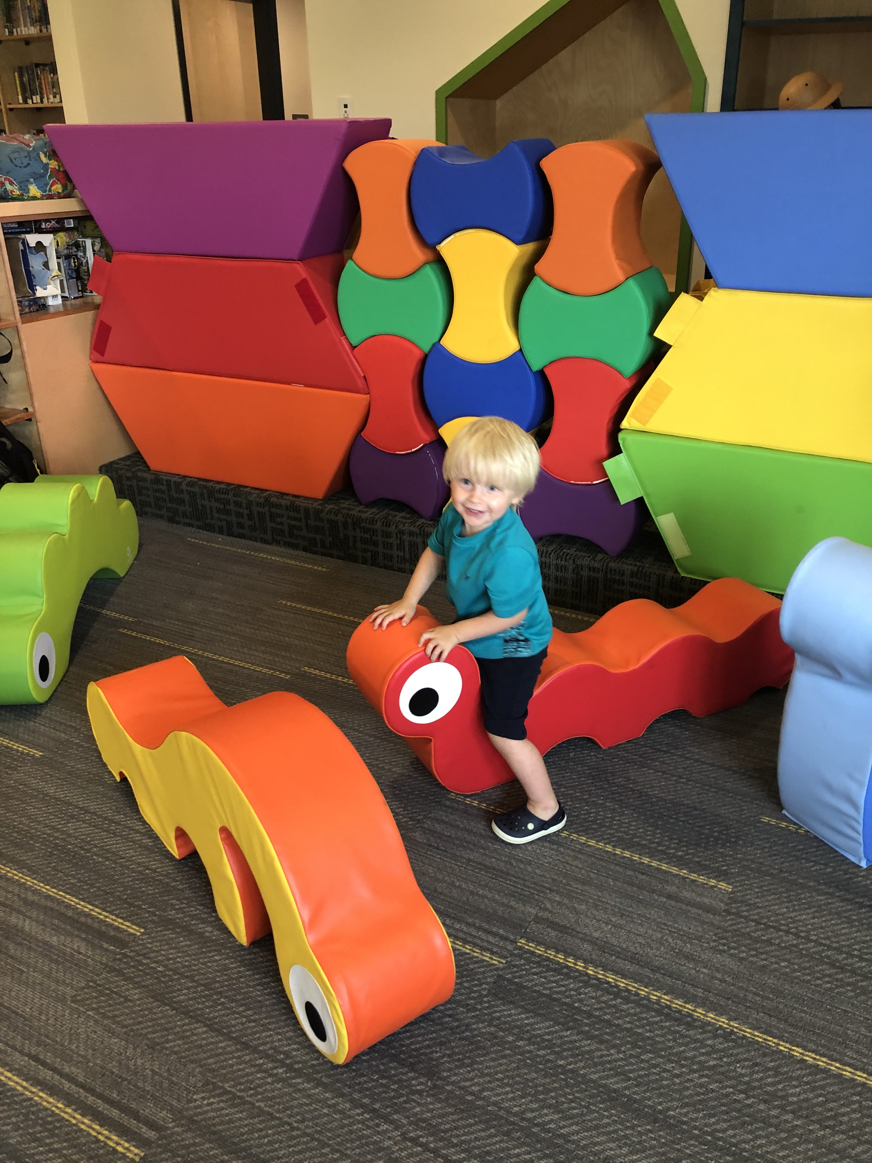 child playing at library